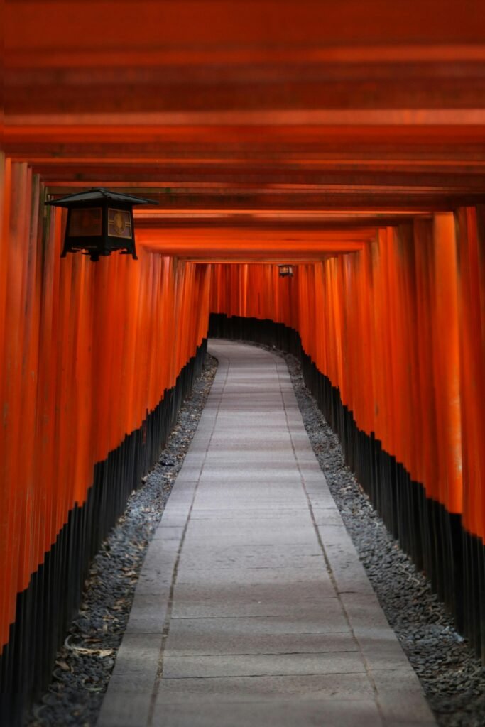 Rows of orange torii gates at Fushimi Inari Taisha shrine in Kyoto