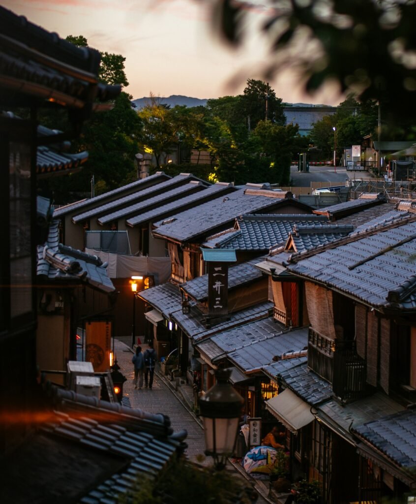 Narrow street lined with traditional wooden machiya houses in Gion, Kyoto