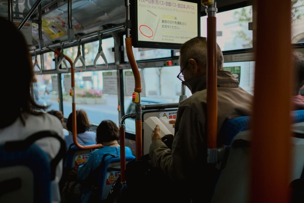 Passengers riding a Kyoto city bus