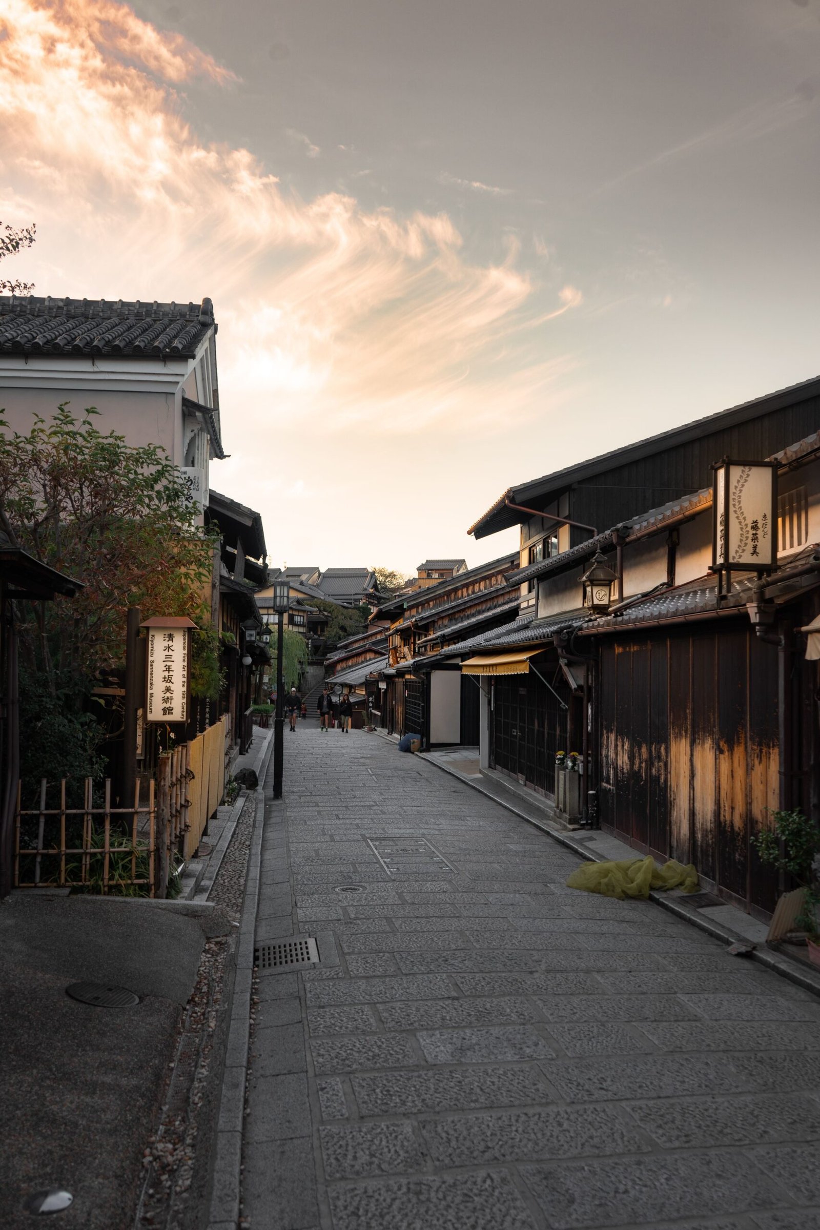 A traditional wooden street in Kyoto at dusk