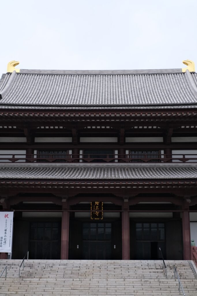 Traditional wooden temple architecture and stone steps in Kyoto