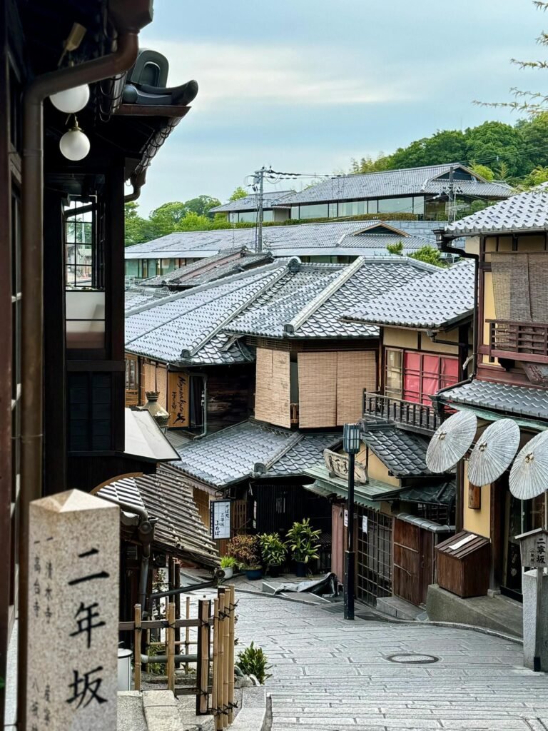 Traditional stone-paved Ninenzaka slope lined with wooden shops near Kiyomizu-dera, Kyoto
