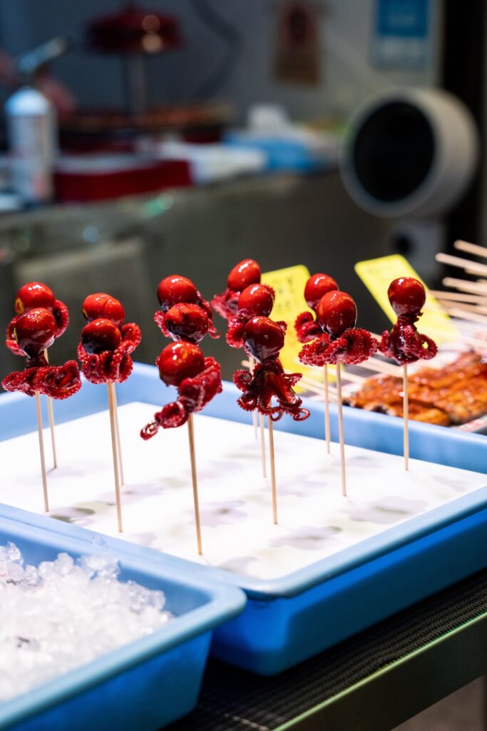 Fresh octopus skewers for sale at a Kyoto street food stall