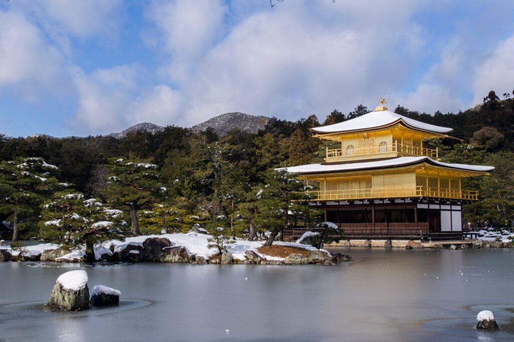 Kinkaku-ji, the Golden Pavilion, reflected in a snow-covered winter landscape, Kyoto