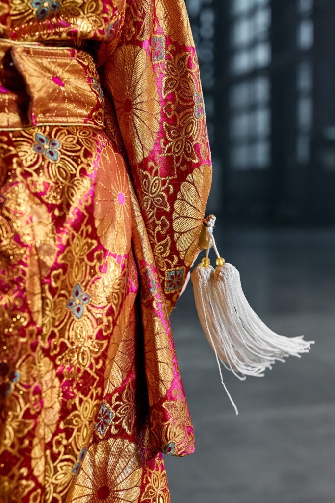 Close-up of a hand-painted silk kimono showing Kyo-yuzen style dyeing