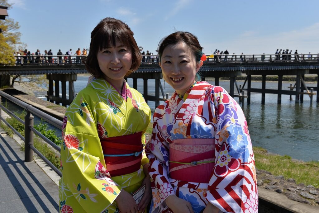 Visitors in kimono at the Togetsukyo bridge in Arashiyama