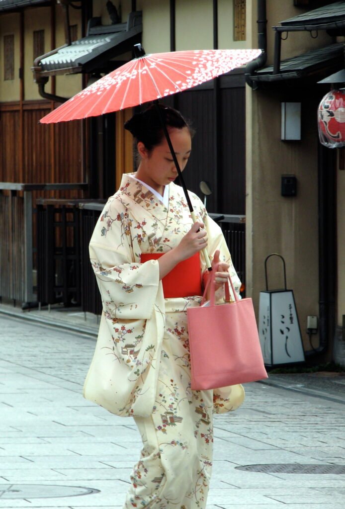 A visitor in kimono walking through Gion
