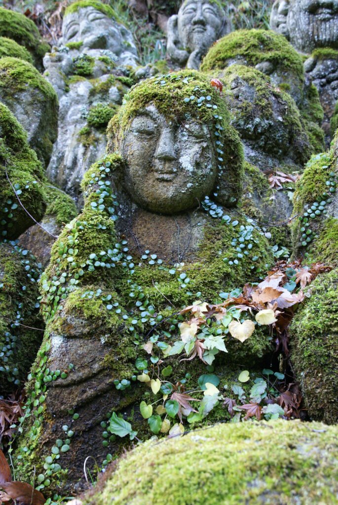 A moss-covered rakan statue at Otagi Nenbutsu-ji, Kyoto